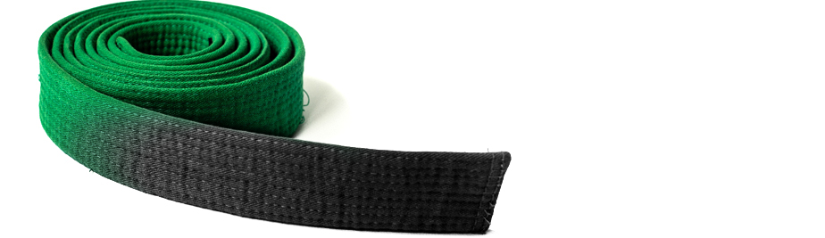 An imag of a Green Belt changing to Black Belt